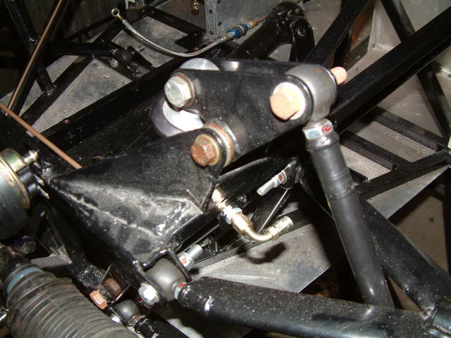 Inboard rising rate suspension